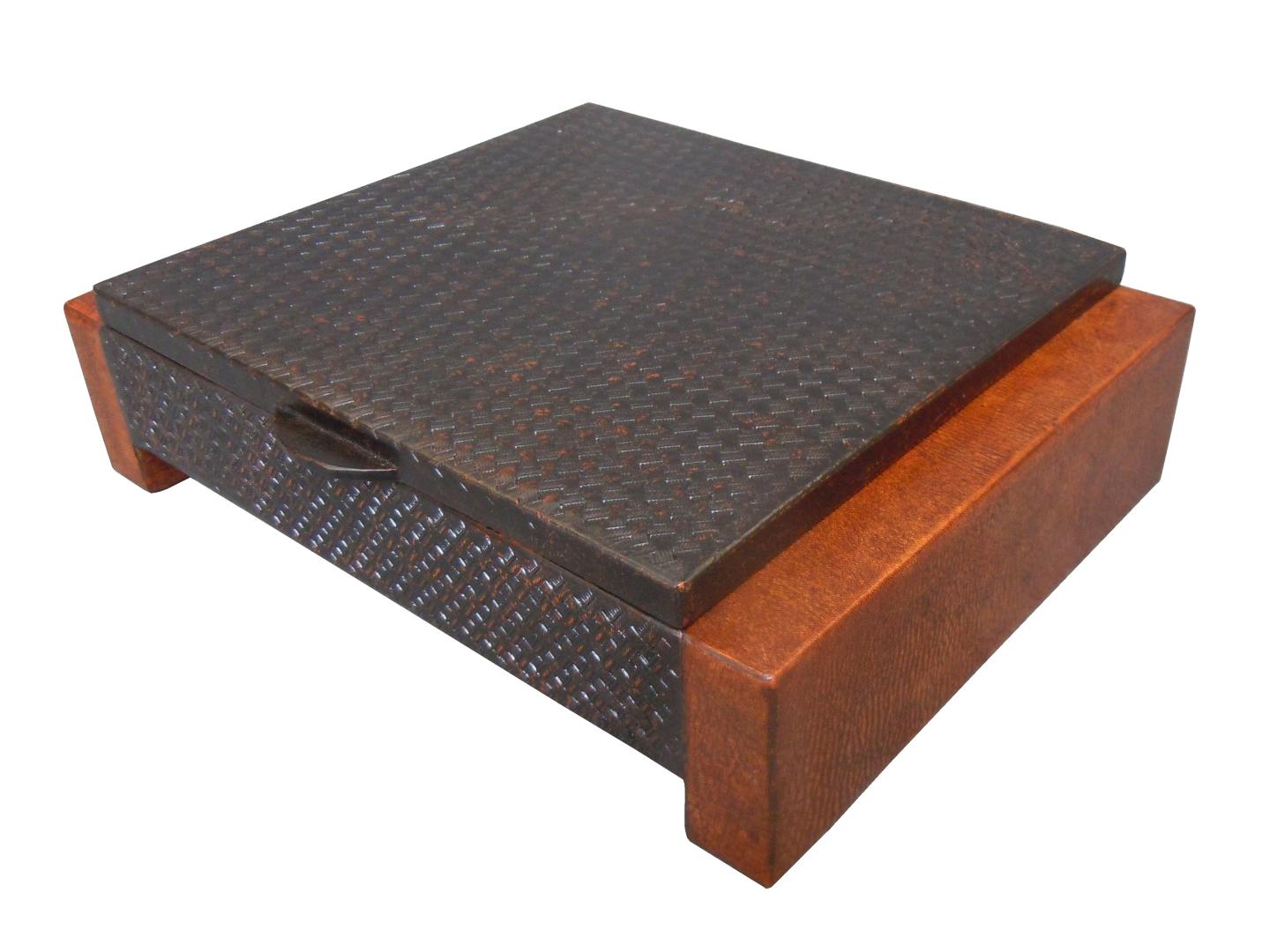 leather box with a braided design on the top
